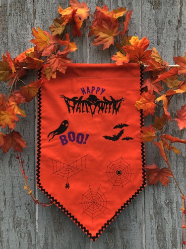 Orange Happy Halloween banner with Halloween-themed embroidery.