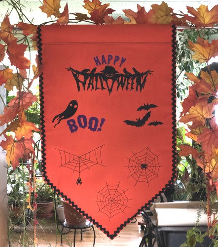 Orange Happy Halloween banner with Halloween-themed embroidery.