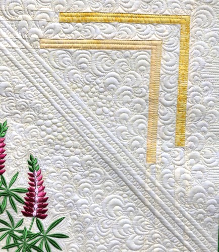 A close-up of the embroidery and quilting stitches.