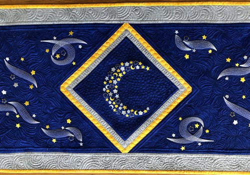 Embroidery of the crescent moon and clouds with stars