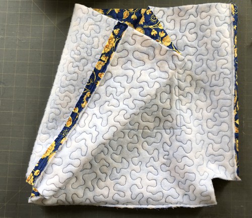 Stitch the sides. Press the seams open. Topstitch on both sides of the seam.