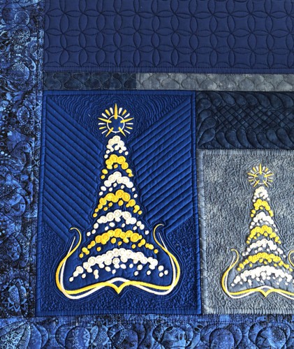 A close-up of the end parts with Trees embroidery