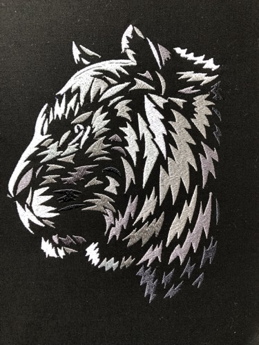 A stitch-out of the silver tiger design.