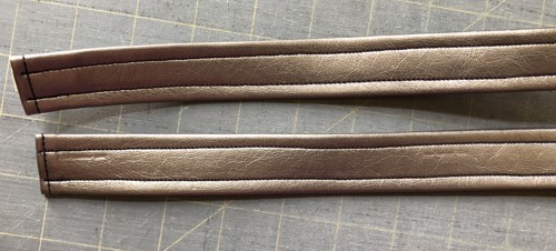 2 handles made of faux leather.