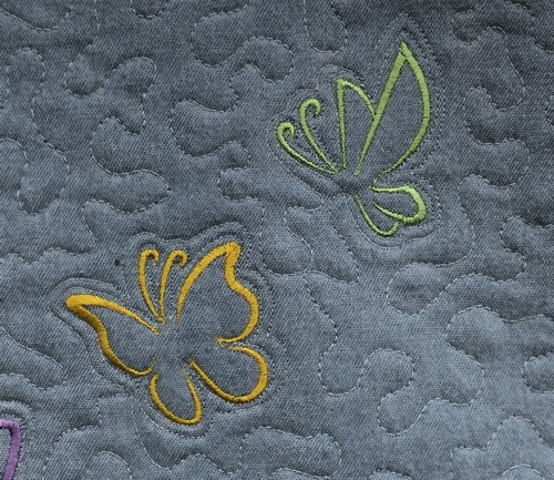 A close-up of the embroidery and quilting stitches.