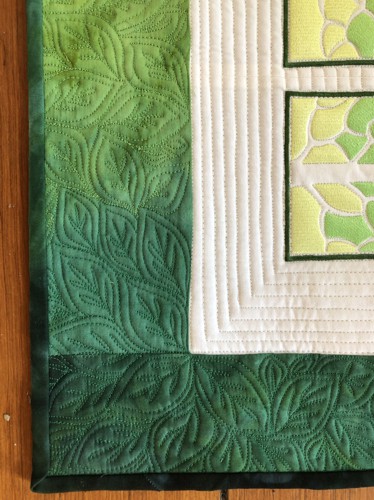 A close-up of the quilting pattern and binding.