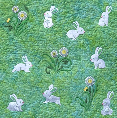 A close-up of the embroidery and quilting stitches on the central part.