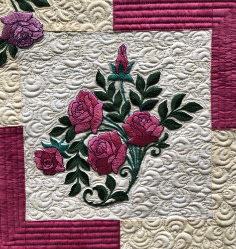 A close-up of the embroidery and quilting stitches.