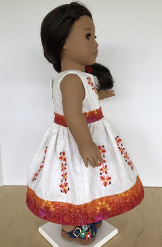 Finished folk style skirt and top on a doll.
