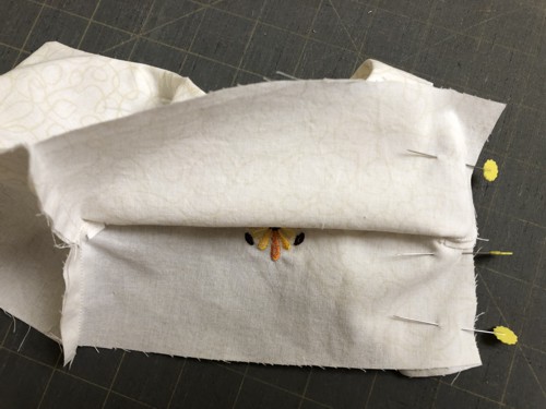 Fold the top and lining to align the sides.