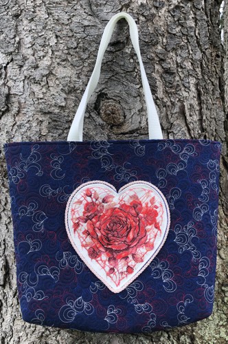 Finished tote bag with embroidery of roses in a heart shape on the front panel.