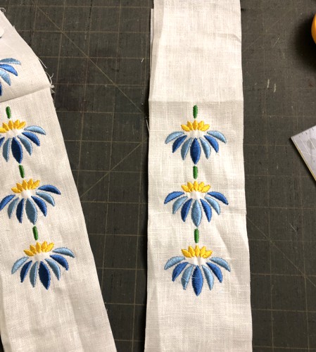 The stitch-outs of the designs for the sash