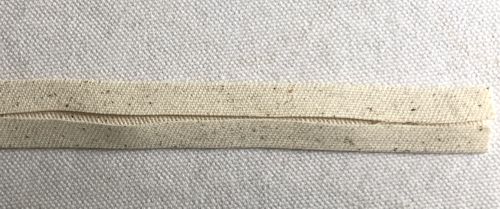 Fold the long edges to the pressed center line and press again.