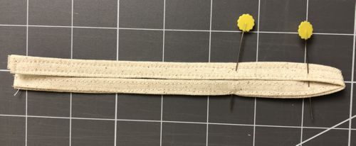 Pin 1" from the V-tip. Measure the button and place another pin on the size of the button