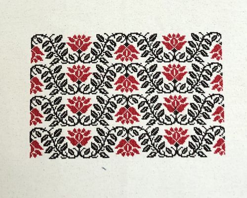 4 stitch-outs of the folklore design on the front panel.