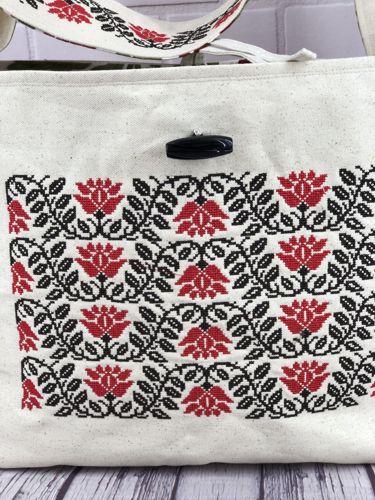 Sew the button to the front panel.
