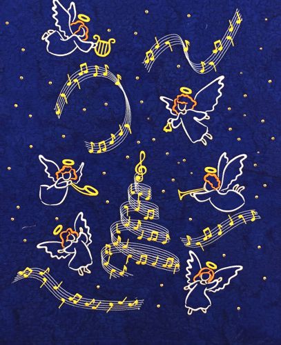 A close-up of the central part of the quilt with embroidery and hot-fix crystals.