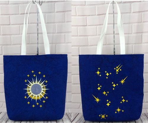 Finished tote bag with embroidery of black catssun and moon on the front panel and stars on the back panel.