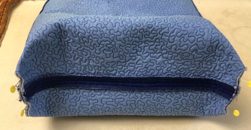 Fold the bottom of the bag so that the bottom and the side seams align. Pin.