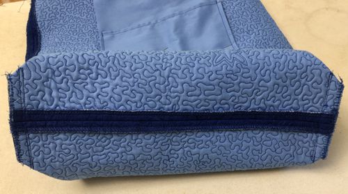 Stitch the bottom with several parallel lines. Finish the raw edge with zig-zag or overlock.
