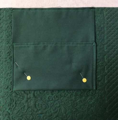The pocket is attached to the back panel.