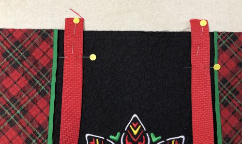 Pin the handle to the upper edges of the panels.