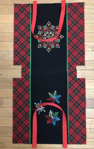 The handles attached to the front and back panels of the tote.