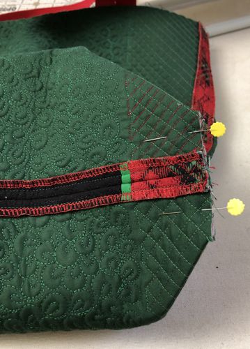 Fold the bottom of the bag so that the bottom and the side seams align. Pin.