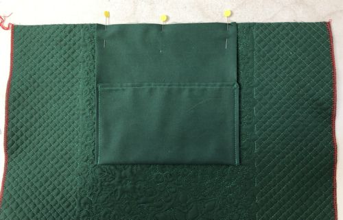 The pocket is pinned to the wrong side of the back panel.