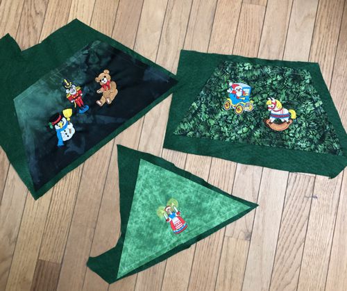 All three parts on pieces of green felt.
