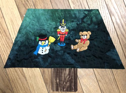 Topstitch the trunk piece to the lower edge of the first tire.