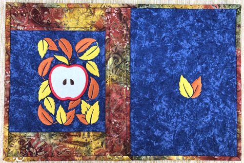 The finished placemat with the apple applique.
