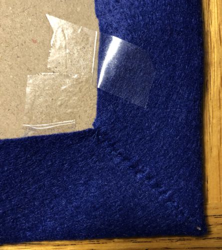 By hand, sew the corners together.