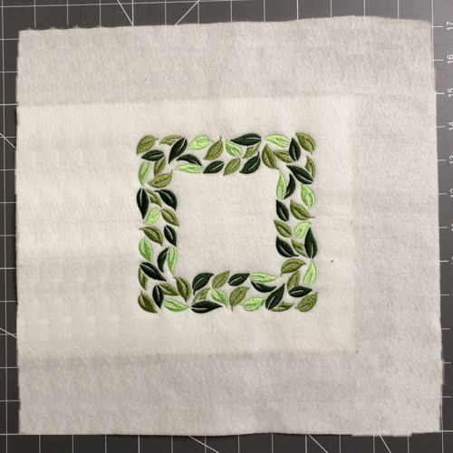 The stitch-out is trimmed, 3" margins around the embroidery