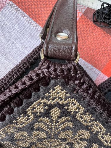 Attached handles of the bag. Close-up.