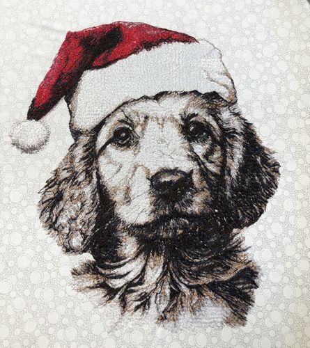 A stitch-out of the golden retriever in a Santa hat on the white background.
