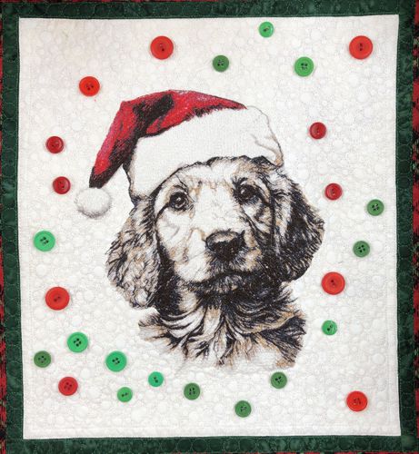 Red and green buttons around the embroidery of the golden retriever.