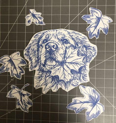 Paper print-outs of the designs for the quilt.