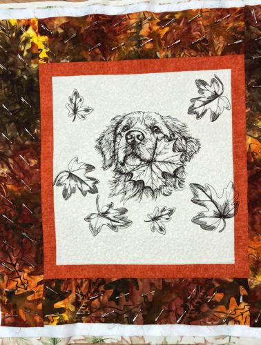 3 layers of the working piece pinned together to be quilted.