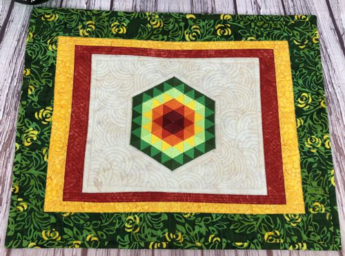A close-up of the embroidery and quilting stitches.