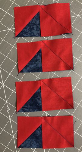 Squares stitched to the right end of the strips.