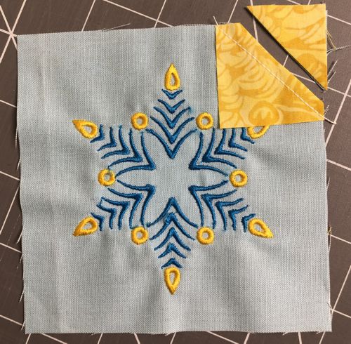 Cut the excess fabric, leaving 1/8" seam allowance.