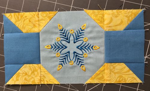 Sew the new unit to the left and right edges of the central square