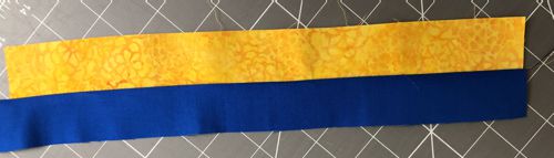 Sew the yellow and blue strips together.