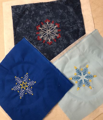Stitch-outs of the snowflakes designs.