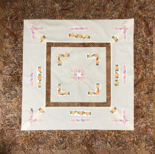 Paper print-outs in the center of the quilt and on light-colored borders to determine the position of the embroidery