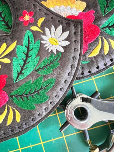 Punch the holes over the embroidered dots.