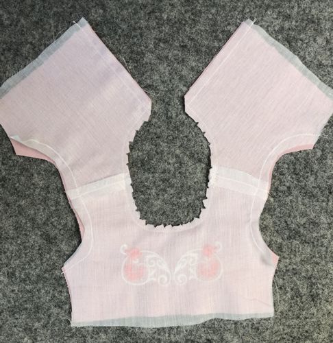 Stitch along the neckline and back.