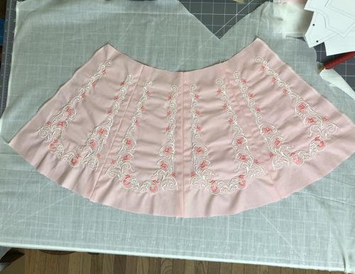 Using the skirt as a template, trace its outline on the lining fabric.