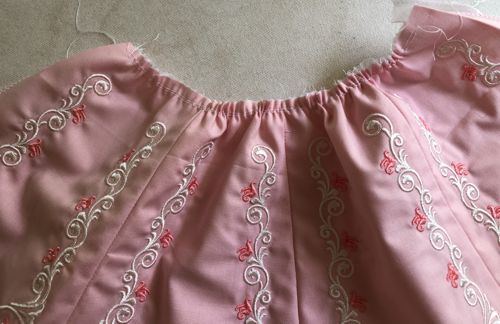 Sew 2 rows of gathering stitches along the waist edge.